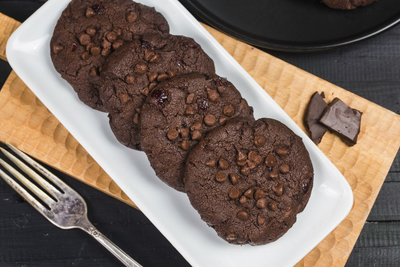Homemade chocolate cookies on wooden table background. Food baki Who say's chocolate cannot be healthy? In this recipe, the chocolate masks the look of the whole wheat flour, making it a wholesome, whole grain treat. The white chocolate contrasts the dark chocolate cookie, making it appealing to even the most discerning palates! Ingredients