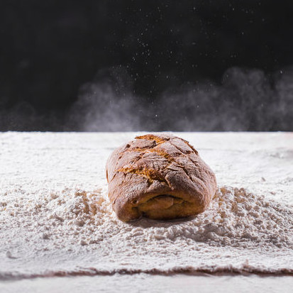 High gluten wheat flour High gluten wheat flour is used for artisan breads to achieve the desired crustiness and chewiness of hearth breads.