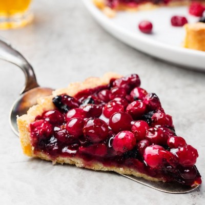 cranberry pie_malic acid A piece of pie with jellied fresh cranberries.