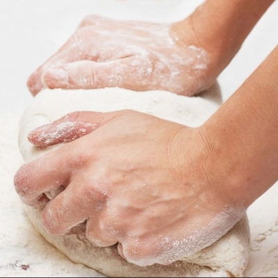 Hand kneading dough Kneading dough is crucial to dough's structure and elastic texture.